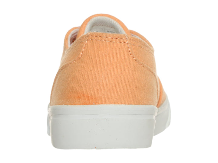 Zapato casual DC Shoes de lona color naranja con suela y cordones blancos.
