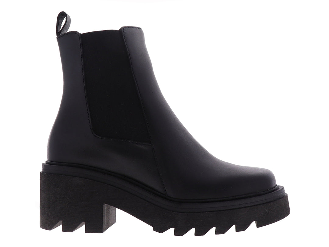Bota Chelsea de cuero negro con suela de plataforma gruesa y dentada.