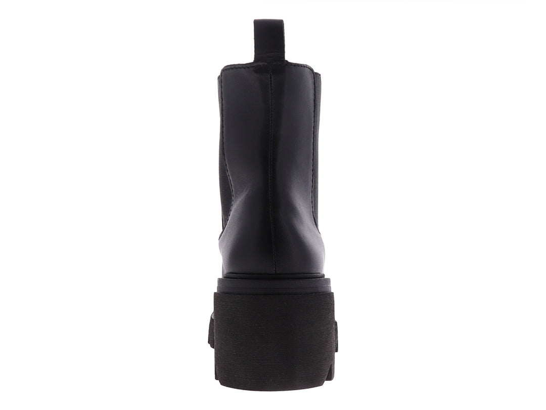 Bota Chelsea de cuero negro con suela de plataforma gruesa y dentada.