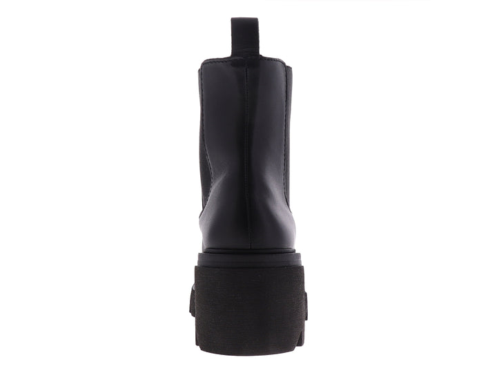 Bota Chelsea de cuero negro con suela de plataforma gruesa y dentada.