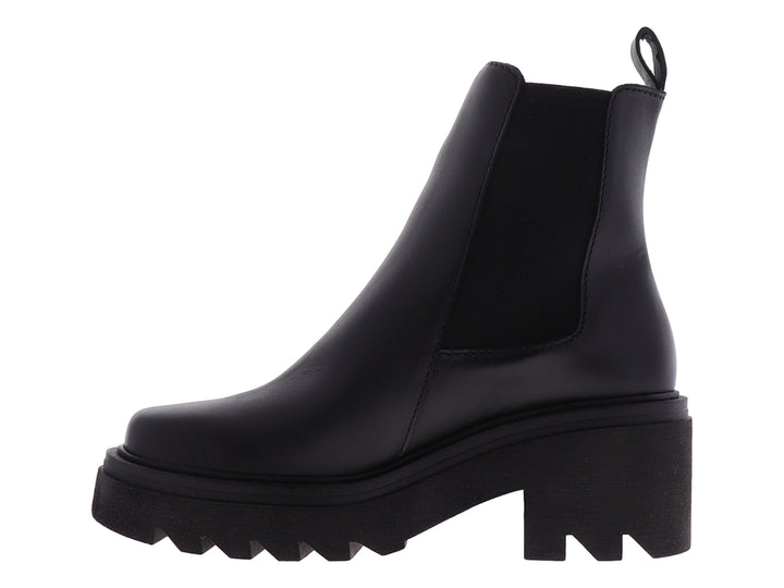 Bota Chelsea de cuero negro con suela de plataforma gruesa y dentada.