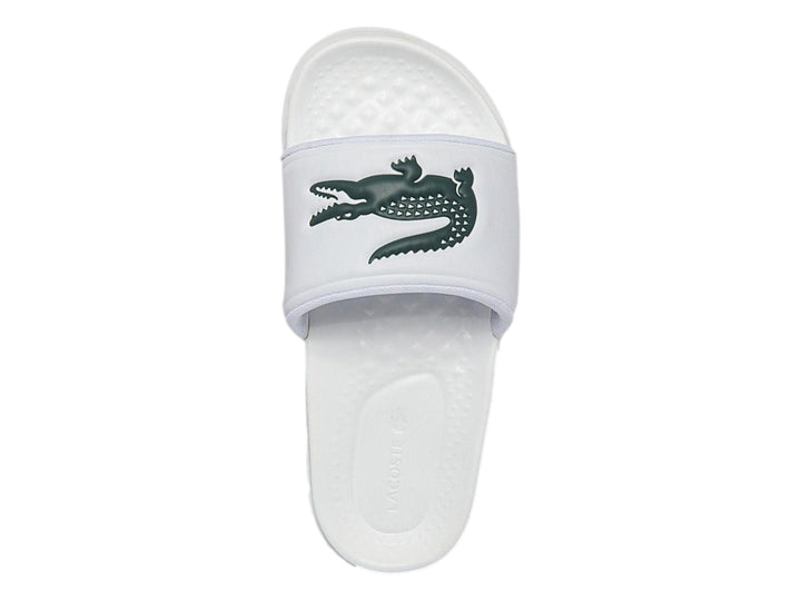 Sandalia deslizante Lacoste de color blanco con logotipo del cocodrilo en verde.