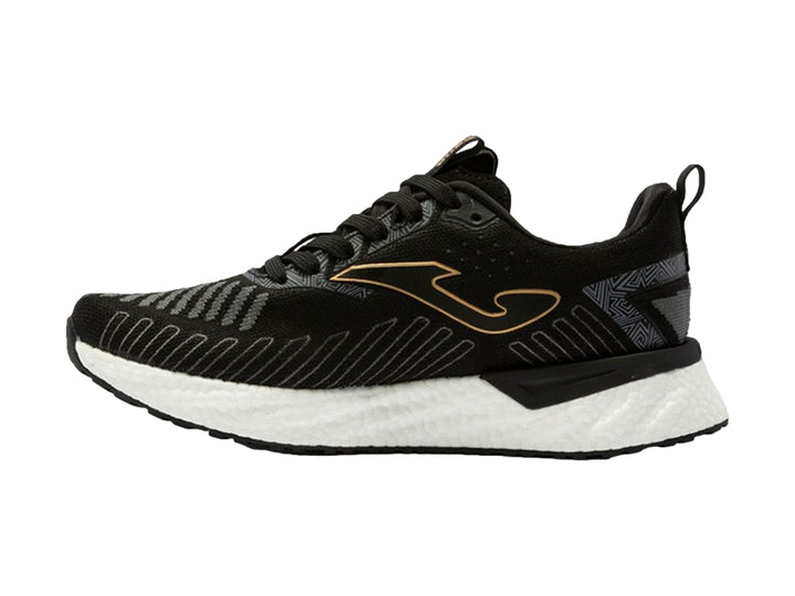 Tenis deportivos Joma color negro con detalles dorados y suela blanca.