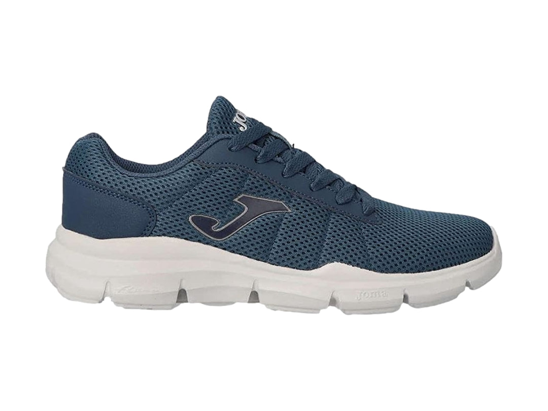 Tenis deportivos Joma color azul marino con suela blanca y tejido transpirable.