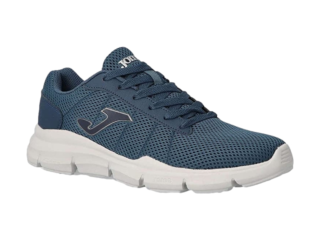 Tenis deportivos Joma color azul marino con suela blanca y tejido transpirable.
