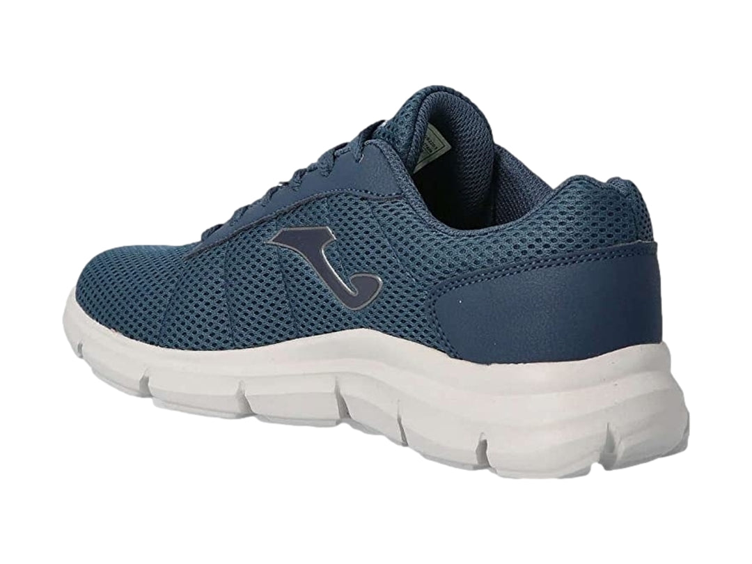 Tenis deportivos Joma color azul marino con suela blanca y tejido transpirable.