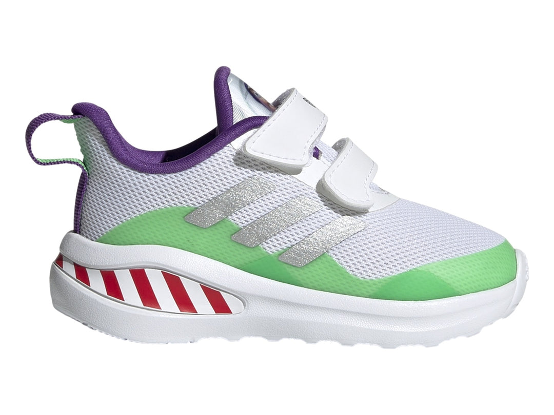 Tenis Adidas blancos con detalles en verde, morado y rayas rojas en la suela.