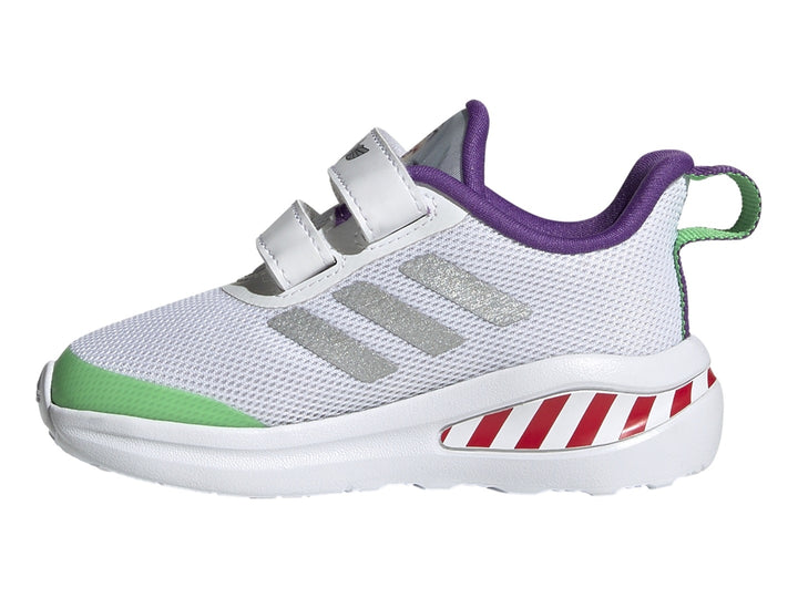 Tenis Adidas blancos con detalles en verde, morado y rayas rojas en la suela.