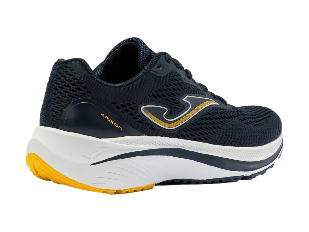 Tenis deportivos Joma en color azul marino con suela blanca y detalles amarillos.
