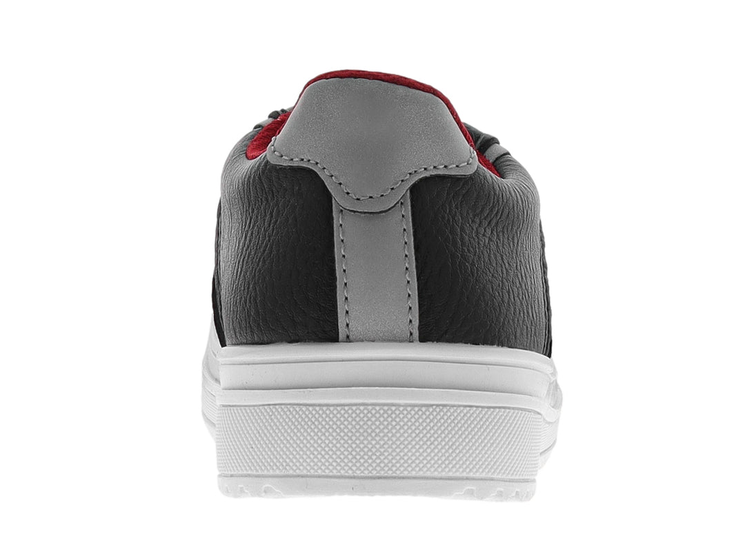 Tenis infantiles Chabelo color negro con suela y cordones blancos y detalles en rojo.