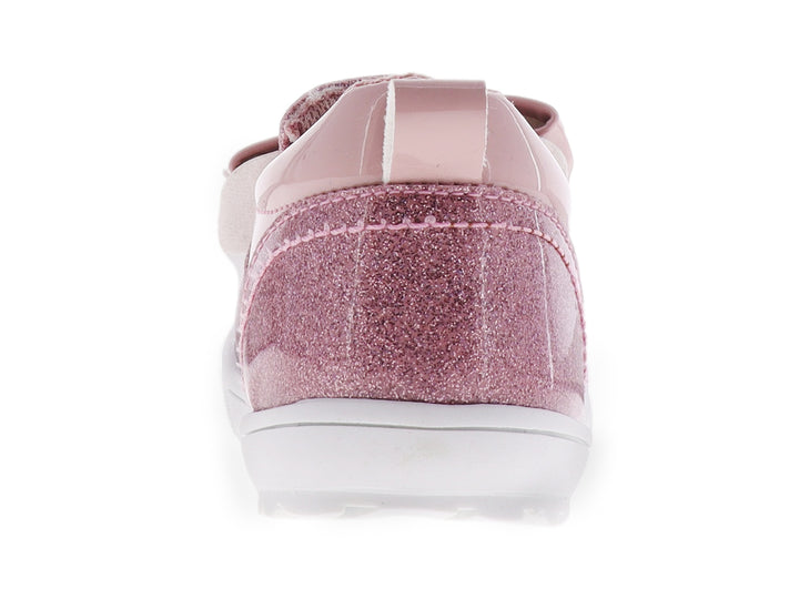 Zapato para niña color lila con detalles de glitter, un moño decorativo y suela blanca.