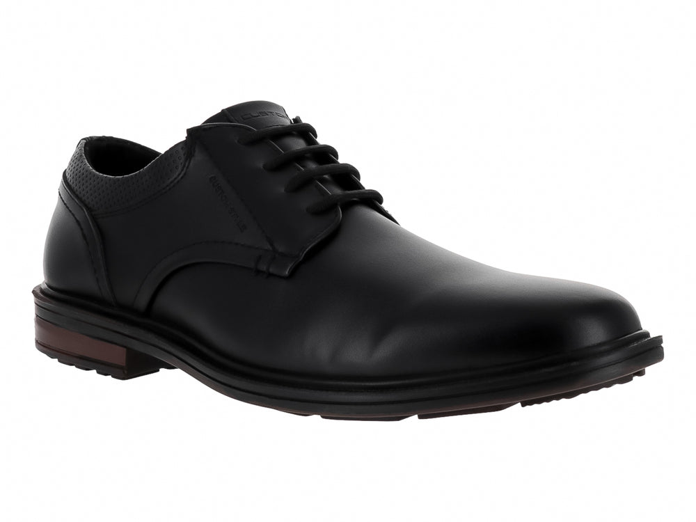 Zapato formal negro de cordones con detalles perforados y suela oscura.
