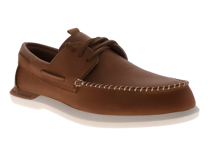 Zapato náutico Sperry de cuero color tan con suela blanca y costuras contrastantes.