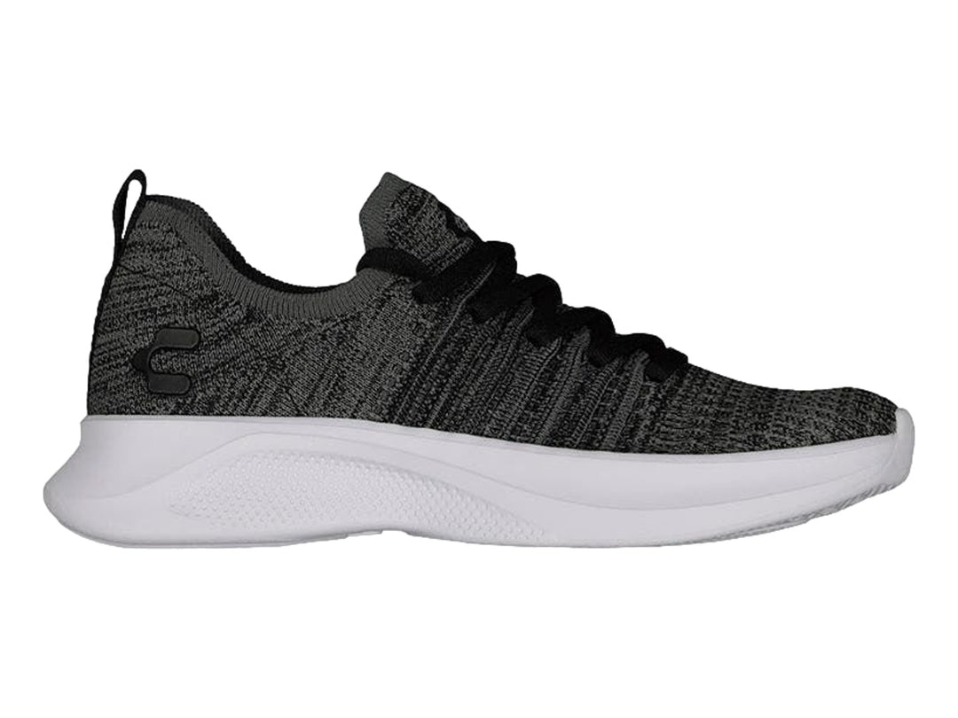 Tenis deportivos Charly de tela tejida en color negro y gris con suela blanca.