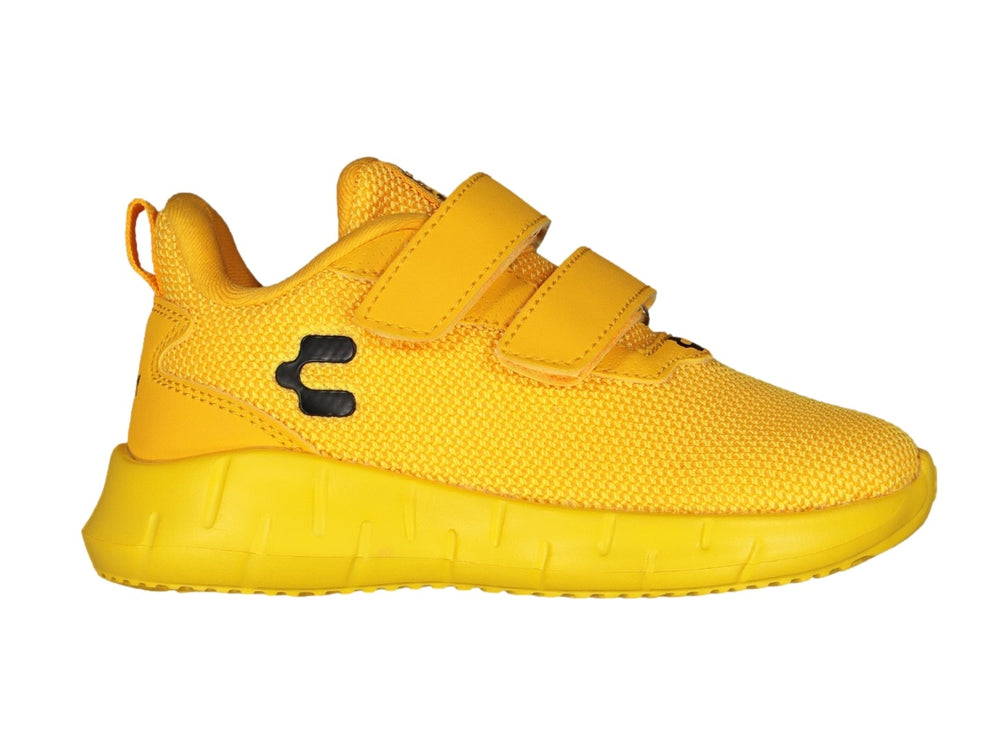 Tenis deportivos Charly para niño en color amarillo brillante con cierre de velcro y suela a juego.