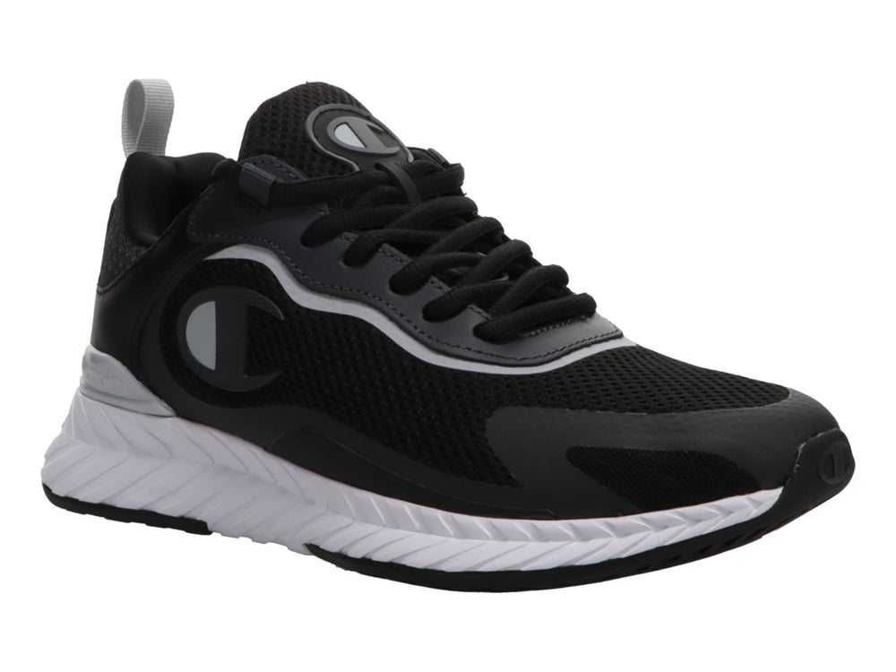 Tenis deportivos Champion color negro con suela blanca y detalles en gris.