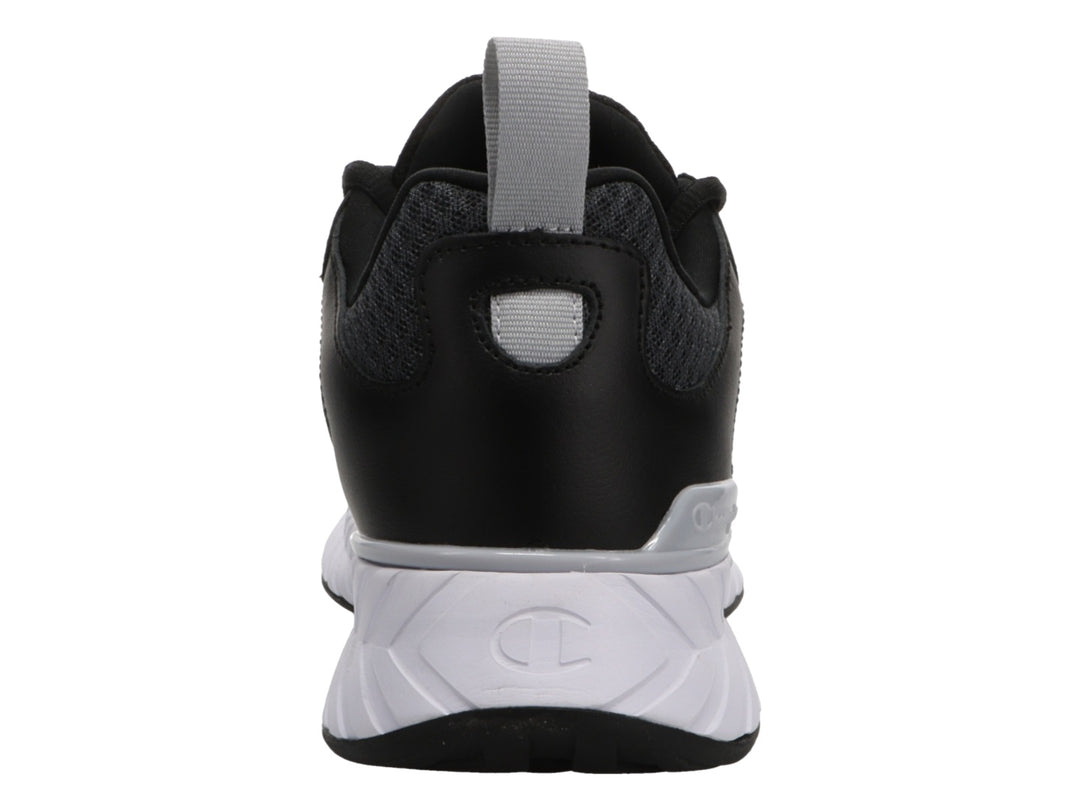 Tenis deportivos Champion color negro con suela blanca y detalles en gris.