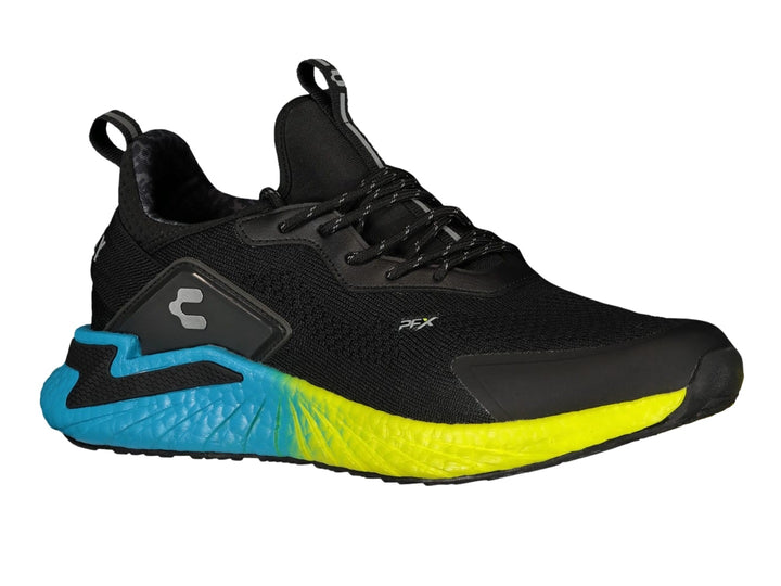 Tenis deportivos Charly color negro con suela en degradado de aqua a amarillo.