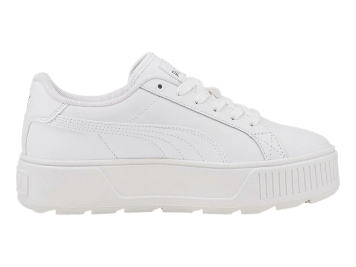 Tenis PUMA blancos con suela de plataforma gruesa y diseño minimalista.