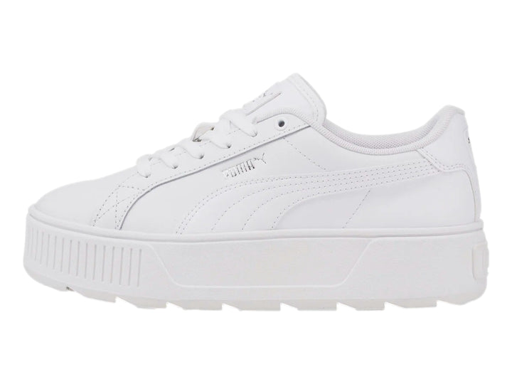Tenis PUMA blancos con suela de plataforma gruesa y diseño minimalista.