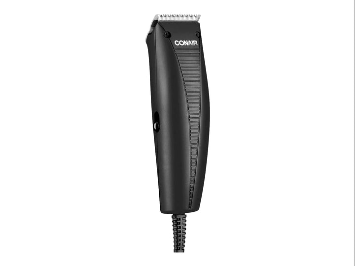 Recortadora de cabello eléctrica Conair en color negro con cuchillas plateadas y cable de alimentación.