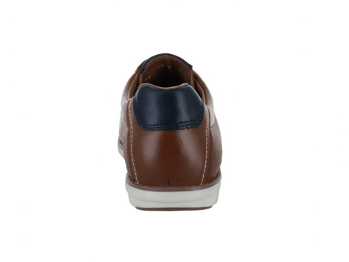Zapato casual Nevada color miel con detalles en azul marino y suela blanca para hombre.