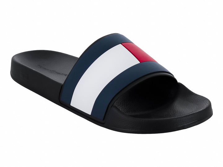 Sandalia slide Tommy Hilfiger color negro con banda tricolor en azul, blanco y rojo.