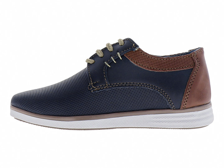 Zapato casual para niño color azul marino con detalles en miel y suela blanca.