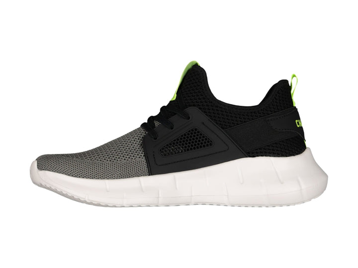 Tenis deportivos Charly color negro y gris con suela blanca y detalles en amarillo neón.