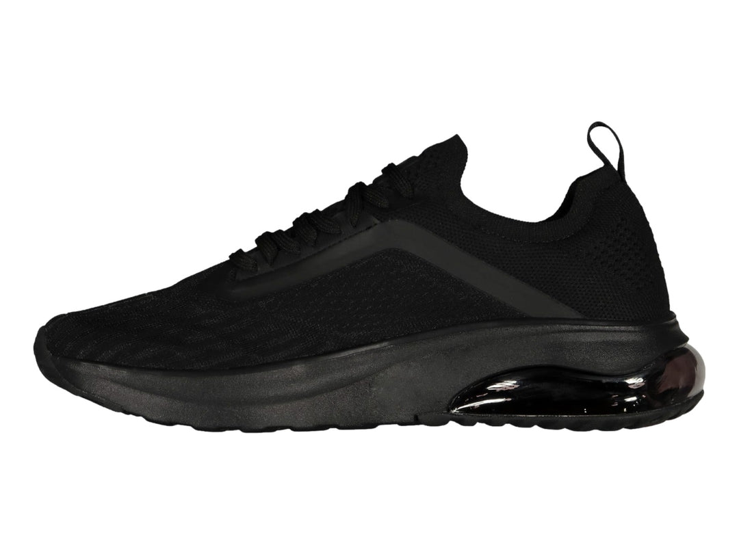 Tenis deportivos Charly de color negro con suela gruesa y tejido transpirable.