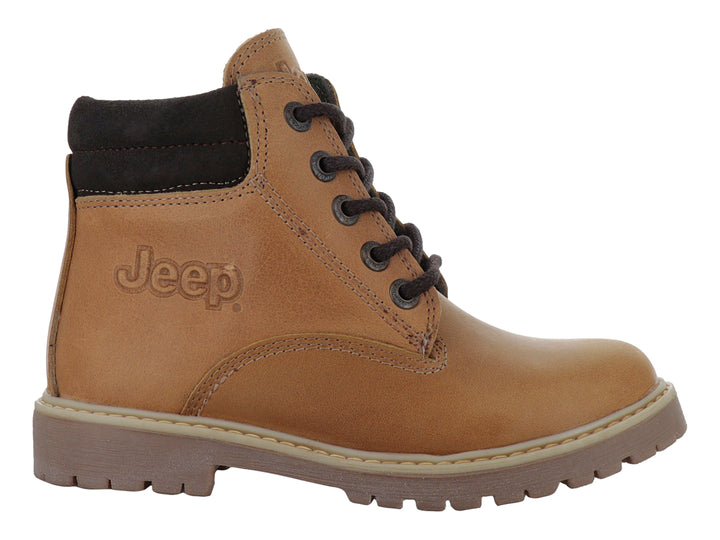 Bota infantil color miel con suela marrón y detalles en gamuza oscura.