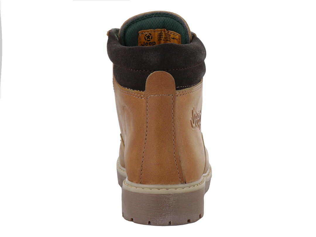 Bota infantil color miel con suela marrón y detalles en gamuza oscura.