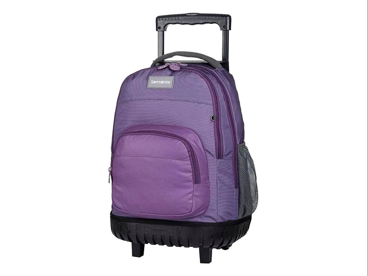 Mochila escolar Samsonite color lila con ruedas y asa extensible negra.