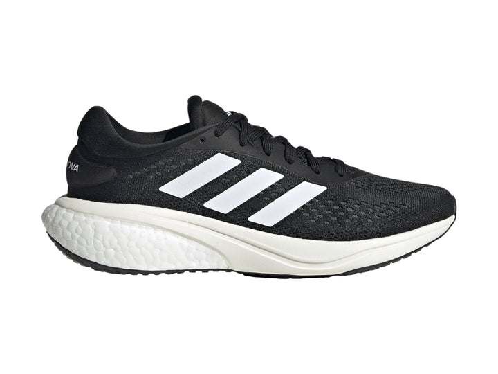 Tenis deportivos Adidas Supernova 2 color negro con suela y franjas blancas.