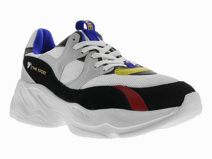 Tenis deportivos chunky color blanco con detalles en negro, azul, rojo y amarillo.
