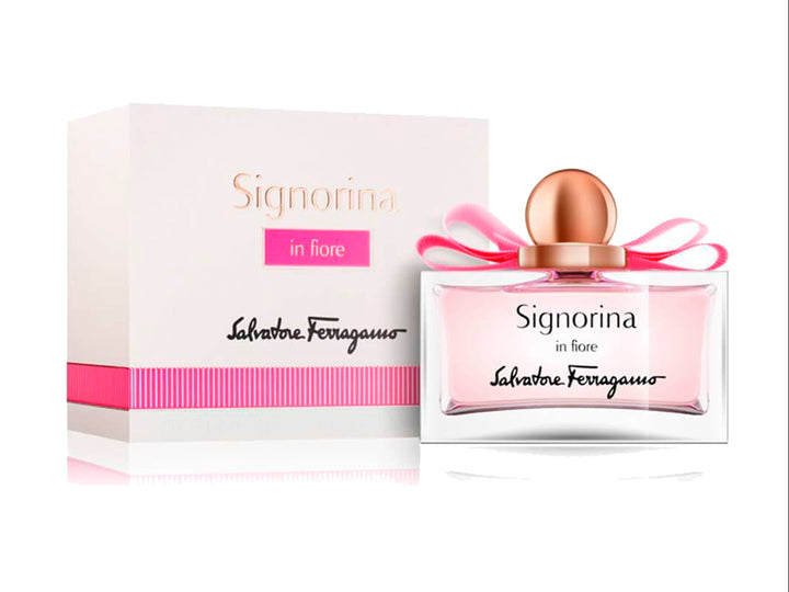 Perfume Salvatore Ferragamo Signorina in Fiore de 100ml con frasco transparente, moño rosa y caja blanca.
