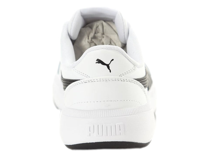 Tenis PUMA blancos con franja negra lateral y suela de plataforma blanca y negra.