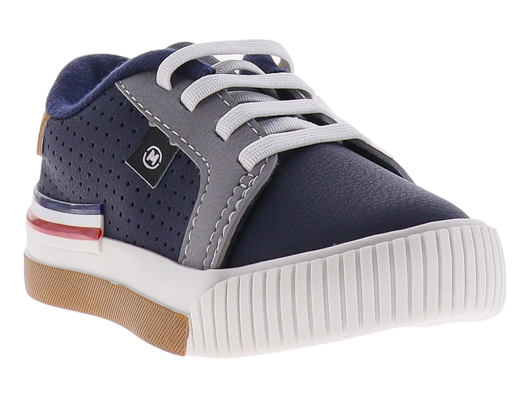 Tenis infantiles color azul marino y gris con suela blanca y detalles laterales.