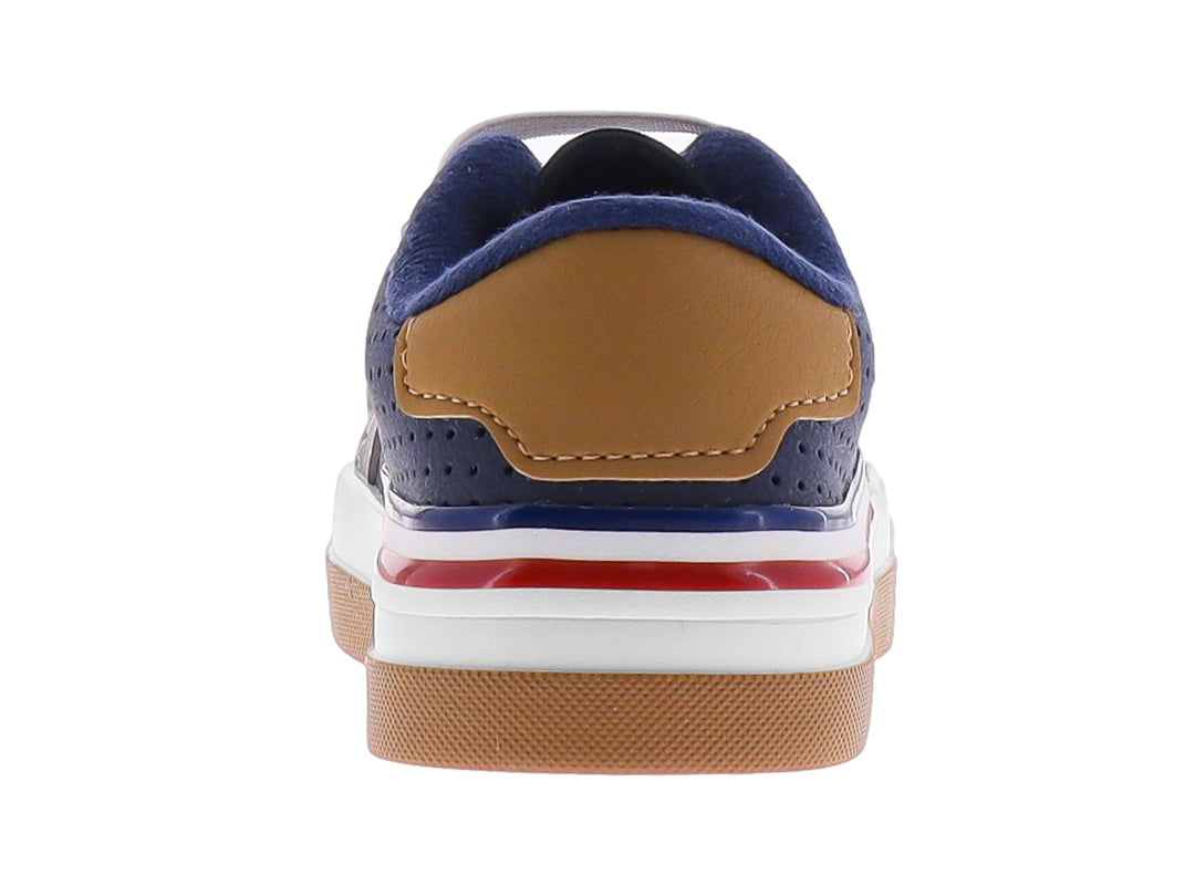 Tenis infantiles color azul marino y gris con suela blanca y detalles laterales.