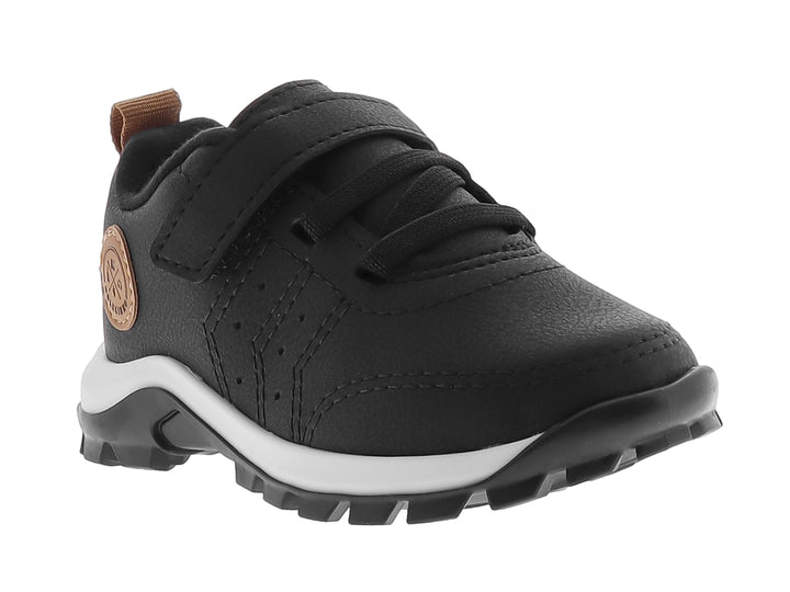 Zapato deportivo infantil color negro con suela blanca y detalles en marrón.