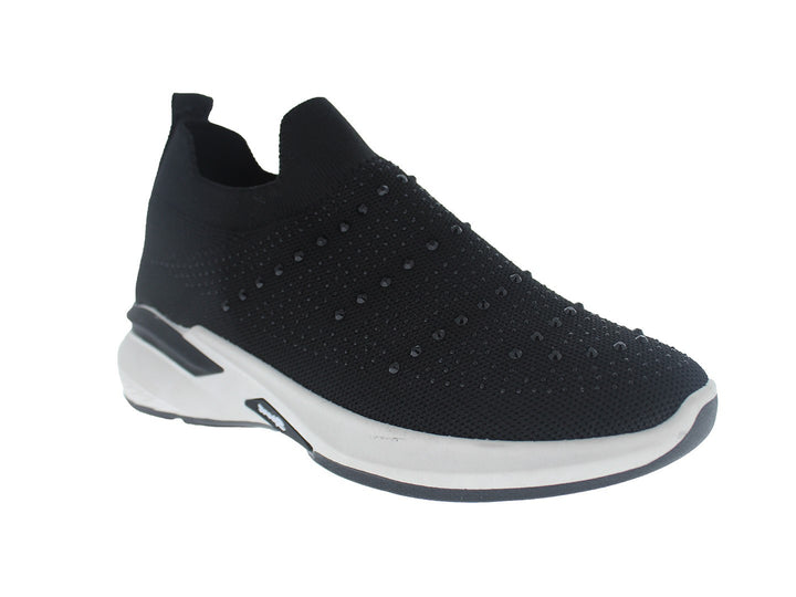 Tenis deportivos Furor color negro con suela blanca, diseño slip-on de tela tejida.