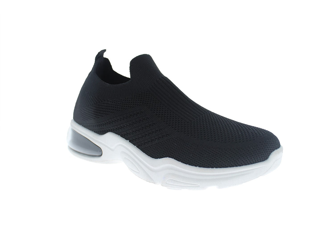 Tenis deportivos FUROR color negro con suela blanca, diseño slip-on sin cordones en tela transpirable.