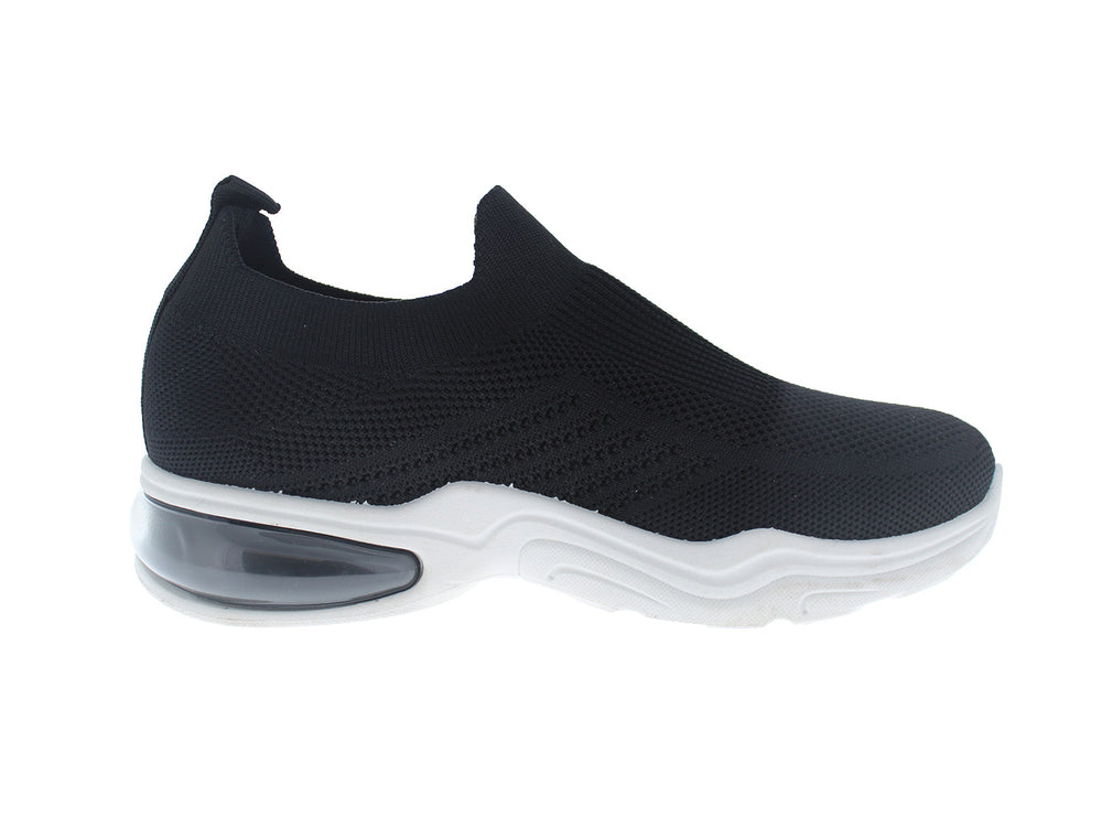 Tenis deportivos FUROR color negro con suela blanca, diseño slip-on sin cordones en tela transpirable.