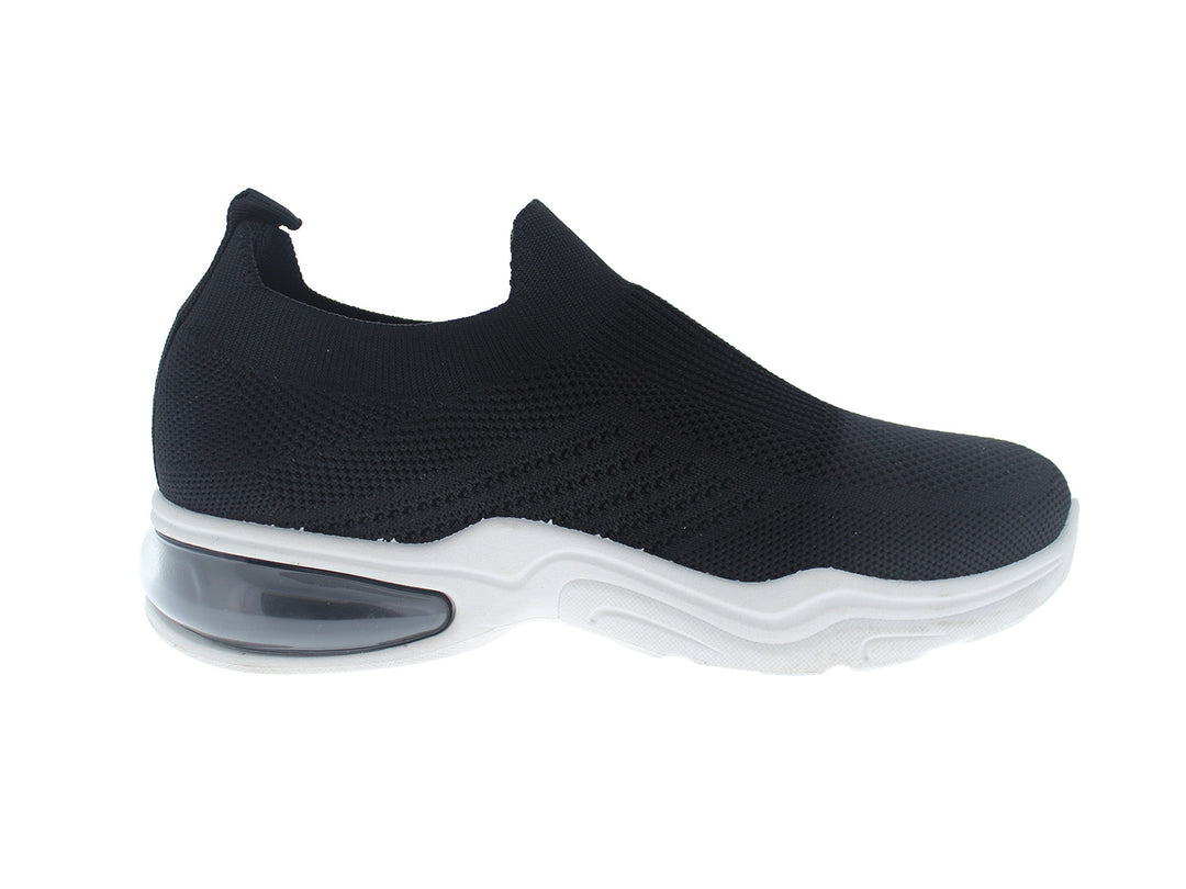 Tenis deportivos FUROR color negro con suela blanca, diseño slip-on sin cordones en tela transpirable.
