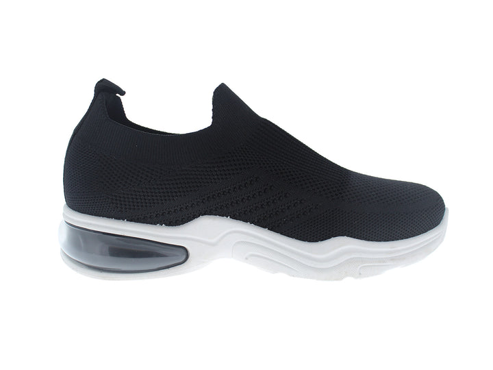 Tenis deportivos FUROR color negro con suela blanca, diseño slip-on sin cordones en tela transpirable.