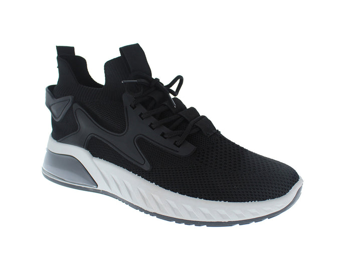 Tenis deportivos Furor color negro con suela blanca y gris, diseño de malla transpirable.