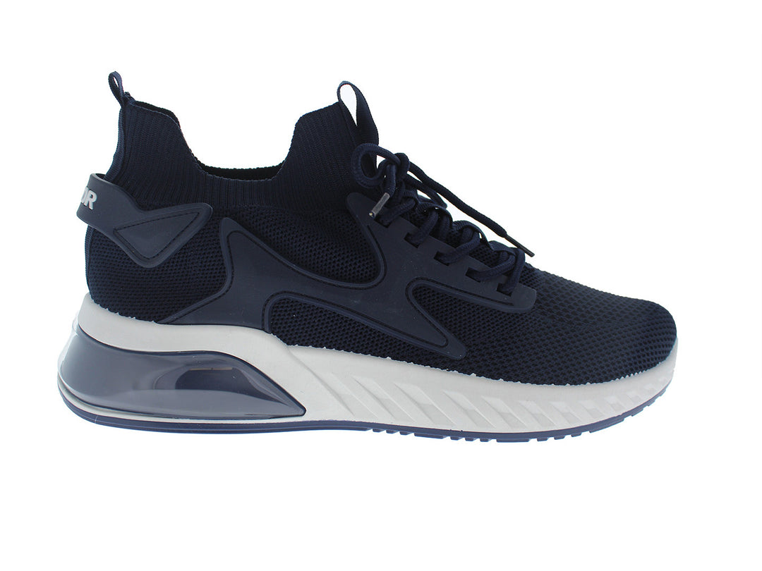 Tenis deportivos FUROR color navy con suela blanca y tejido transpirable.