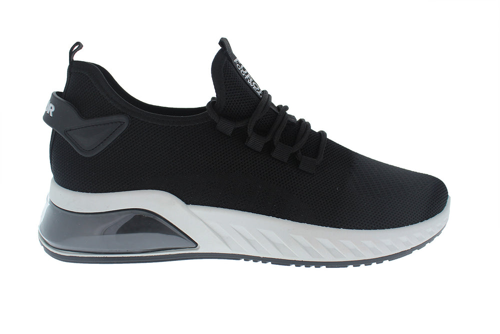 Tenis deportivos Furor de color negro con suela blanca y tejido transpirable.