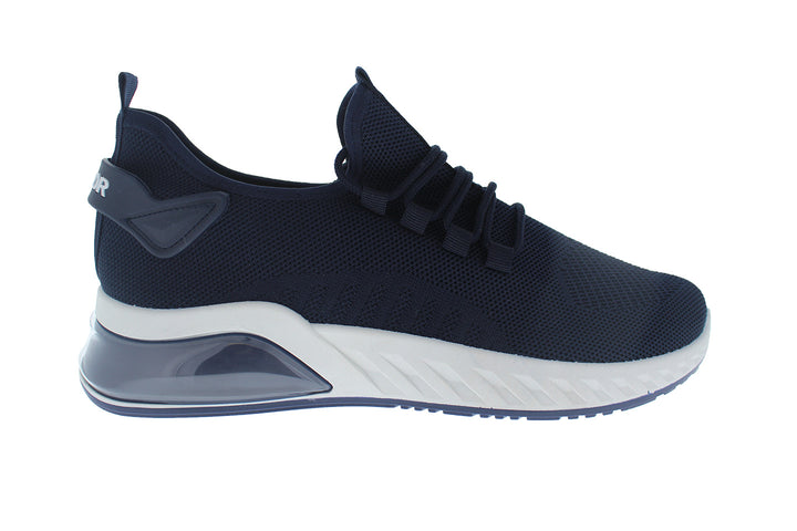 Tenis deportivos Furor color navy con suela blanca y tejido transpirable.