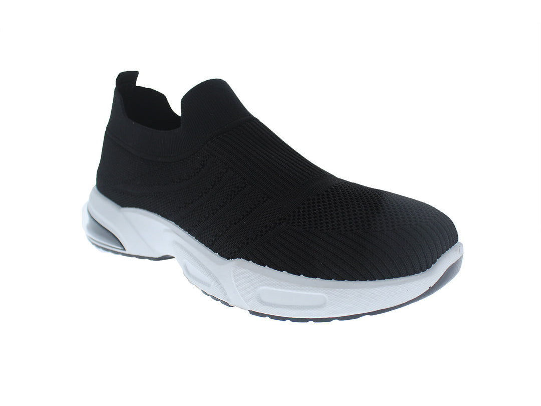 Tenis deportivos FUROR color negro con suela blanca, diseño slip-on de tela tejida.